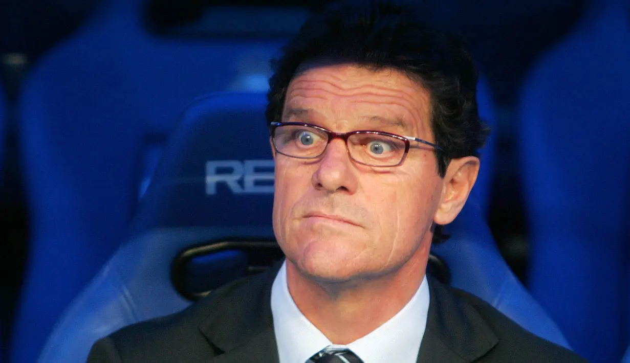 6. Fabio Capello (Real Madrid) - Pria asal Italia ini dipecat lantaran Real Madrid gugur di 16 besar Liga Champions pada 2007. Naasnya pemecatan itu terjadi setelah keberhasilan Capello mempersembahkan gelar juara La Liga. (AFP/Pierre-Philippe Marcou)