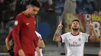 Selebrasi penyerang AC Milan, Patrick Cutrone usai menjebol gawang AS Roma. (Andreas SOLARO / AFP)