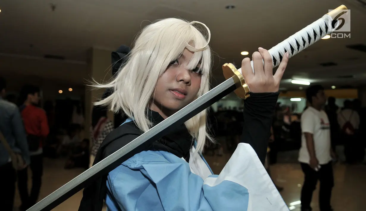 Cosplay berpose di Festival Ennichisai, Jakarta, Minggu (1/7). Festival ini dimeriahkan oleh para penggemar berkostum ala film animasi, komik, hingga karakter video game atau yang lebih dikenal dengan istilah Cosplay. (Merdeka.com/Iqbal S. Nugroho)