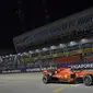 Pembalap Ferrari Sebastian Vettel juara balapan Formula 1 (F1) GP Singapura di Sirkuit Marina Bay, Minggu (22/9/2019). (AFP/Roslan Rahman)