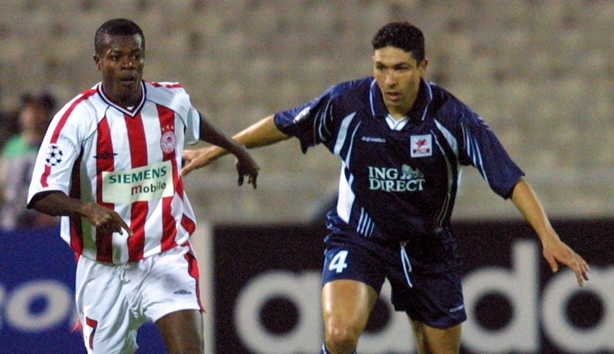 Peter Ofori-Quaye (Olimpiakos) di posisi ke-2. Mampu mencetak gol saat berusia 17 tahun 195 hari saat Olimpiakos bertandang ke Rosenborg pada 1 Oktober 1997 dalam fase grup Liga Champions musim 1997/1998. Hasil akhir, Olimpiakos kalah 1-5 dari Rosenborg. (AFP/Denis Charlet)
