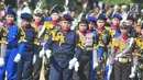 Polisi Cilik memeriahkan kirab defile perayaan HUT ke-73 Bhayangkara di kawasan Simpang Lima Semarang, Rabu (10/7/2019). Kirab defile itu menampilkan aeromodeling, polisi cilik, seni bela diri, drum band, barongsari, kesenian Jateng, komunitas,dan Ormas. (Liputan6.com/Gholib)