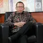 Calon hakim Mahkamah Konstitusi (MK) Arsul Sani berpose usai wawancara khusus dengan Liputan6.com di Jakarta, Kamis (11/1/2024). (Liputan6.com/Herman Zakharia)