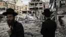 Otoritas Teheran menyebut ratusan rudal ditembakkan ke target-target strategis dan sensitif di Tel Aviv, termasuk kota pelabuhan Haifa pada Senin (16/6/2025) dini hari waktu setempat. (JOHN WESSELS/AFP)