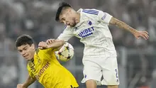 Pemain Borussia Dortmund, Giovanni Reyna (kiri), duel udara dengan pemain FC Copenhagen, Kevin Diks, pada laga Liga Champions di Stadion Signal Iduna Park,  Rabu (7/9/2022). (AP/Martin Meissner)