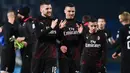 Pemain AC Milan, Ante Rebic, Mattia Caldara dan Ismael Bennacer merayakan kemenangan atas Brescia pada akhir pertandingan lanjutan kompetisi Liga Italia Serie A di Stadion Mario Rigamonti, Jumat (24/1/2020). AC Milan menang 1-0 lewat gol tunggal Ante Rebic. (MIGUEL MEDINA / AFP)