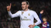 Gareth Bale. Sayap kanan asal wales berusia 32 tahun ini didatangkan Real Madrid dari Tottenham Hotspur pada awal musim 2013/2014 dengan nilai transfer sebesar 101 juta euro. Kini, hingga musim ke-8 bersama Los Blancos ia telah tampil dalam 258 laga di semua ajang dengan torehan 106 gol dan 67 assist. Akhir musim ini ia diperkirakan akan meninggalkan Santiago Bernabeu untuk kembali ke Inggris. Gelar bergengsi yang berhasil diraihnya adalah 3 kali juara La Liga dan 4 kali juara Liga Champions. (AFP/Josep Lago)