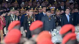Presiden Prabowo Subianto memimpin sekaligus menjadi inspektur upacara Hari Ulang Tahun (HUT) ke-79 Bhayangkara yang diselenggarakan di Lapangan Monumen Nasional (Monas), Jakarta Pusat, pada Selasa 1 Juli 2025. (BAY ISMOYO/AFP)