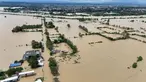 Foto udara menunjukkan rumah-rumah yang terendam banjir akibat hujan lebat yang disebabkan oleh Badai Tropis Trami di Kota Tuguegarao, provinsi Cagayan, Filipina pada Jumat 25 Oktober 2024. (John Dimain/AFP)
