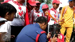 Acara tersebut digelar untuk memberikan pemahaman dan pengetahuan kepada murid-murid Madrasah agar siaga menghadapi bencana di sekitar mereka, Jakarta, Minggu (22/1).  (Liputan6.com/Johan Tallo)