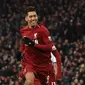 Roberto Firmino berhasil mencetak gol Liverpool yang ke-1000 di Stadion Anfield, saat bersua Crystal Palace, pada laga pekan ke-23 Premier League, Sabtu (19/1/2019). (AFP/Paul Ellis)