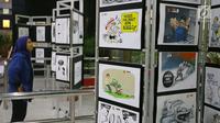Sejumlah karya komik dan ilustrasi antikorupsi digelar dalam pameran bertajuk AKU KPK ( Aksi Komik Untuk KPK) di Gedung KPK, Jakarta, Rabu (23/8). Pameran tersebut didukung oleh Persatuan Kartunis Indonesia (Pakarti). (Liputan6.com/Helmi Afandi)