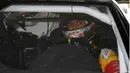 Sean Gelael saat mempersiapkan mobil Lamborghini pada ajang Taxi Ride di Sentul, Jakarta, Selasa (2/8/2016). (Bola.com/Nicklas Hanoatubun)