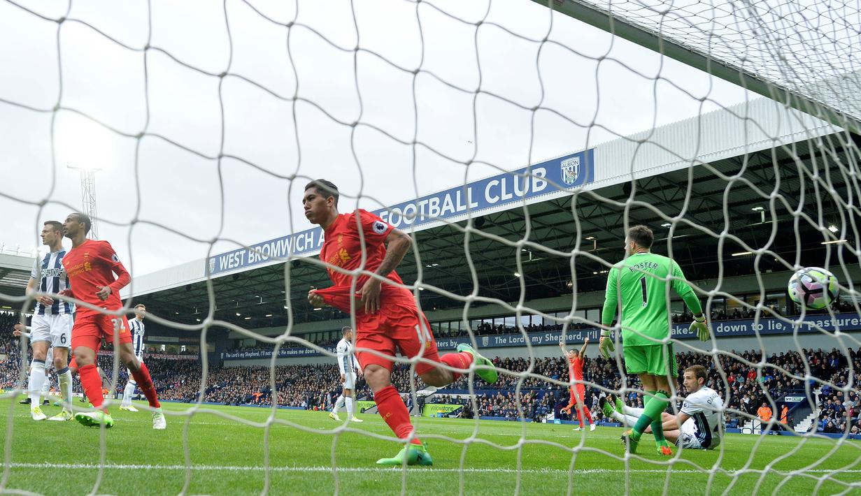 Penyerang Liverpool, Roberto Firmino, melakukan selebrasi usai mencetak gol ke gawang West Bromwich Albion. Gol Roberto Firmino menjadi gol satu-satunya dalam pertandingan tersebut. (AFP/Justin Tallis)