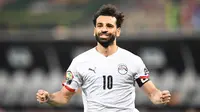 Mohamed Salah berhasil menjadi penentu kemenangan Mesir saat menumbangkan Pantai Gading di babak 16 besar Piala Afrika 2021 yang berlangsung di Stade Omnisport de Douala, Rabu (26/1/2022) malam WIB. (AFP/Charly Triballeau)