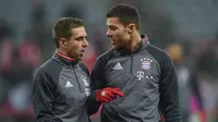Philipp Lahm dan Xabi Alonso nantikan laga Bayern Munchen kontra Real Madrid. (AFP/Christof Stache)