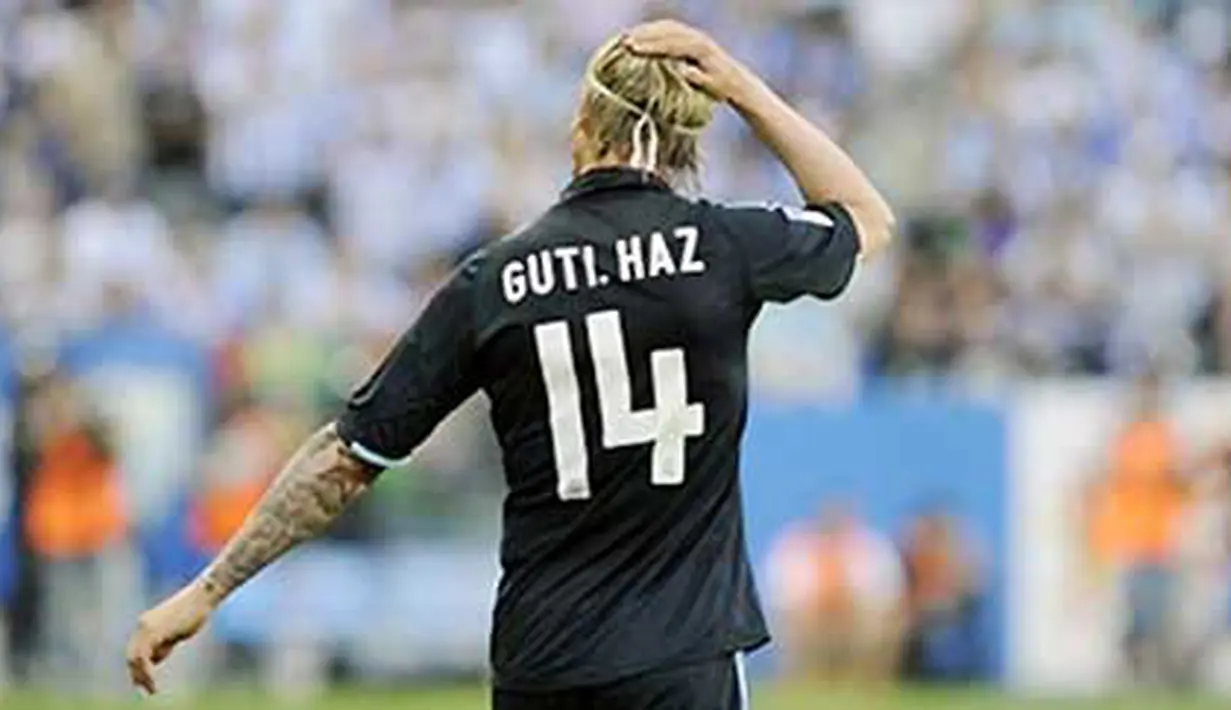 Ekspresi gelandang Real Madrid Guti. AFP PHOTO / CRISTINA QUICLER
