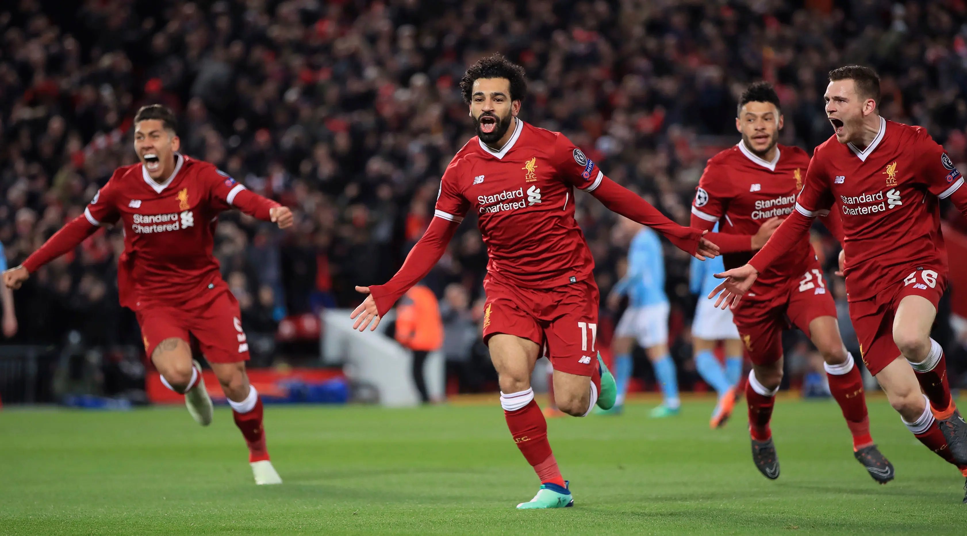 Penyerang Liverpool Mohamed Salah merayakan gol bersama rekan setimnya saat melawan Manchester City dalam pertandingan Liga Champions di Anfield, Liverpool (4/4). (Peter Byrne/PA via AP)