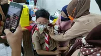 Vaksinasi anak di SD Negeri 01, Kelurahan Bendungan Hilir, Kecamatan Tanah Abang, Jakarta Pusat, Rabu (15/12/2021). (Ist)