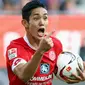 Striker Mainz, Yoshinori Muto dilaporkan segera menandatangani kesepakatan dengan United dalam bursa transfer musim dingin ini. (sumber: bundesliga.com)