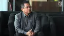 Sekretaris Jenderal DPR, Indra Iskandar menunggu panggilan penyidik KPK saat akan menjalani pemeriksaan di Jakarta, Senin (22/4). Indra Iskandar diperiksa sebagai saksi untuk tersangka Romahurmuziy terkait kasus dugaan jual beli jabatan di Kementerian Agama tahun 2018-2019. (merdeka.com/Dwi Narwoko)