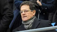 Pelatih Inggris, Fabio Capello duduk di tribun menyaksikan laga putaran kelima FA Cup antara Manchester City dan Stoke City di City of Manchester Stadium, 13 Februari 2010. AFP PHOTO / ANDREW YATES