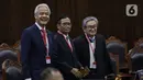 Calon presiden dan calon wakil presiden nomor urut 3 Ganjar Pranowo dan Mahfud MD hadir dalam sidang putusan perkara Perselisihan Hasil Pemilihan Umum (PHPU) atau putusan sidang sengketa Pilpres 2024 di Mahkamah Konstitusi (MK), Senin (22/4/2024). (Liputan6.com/Angga Yuniar)