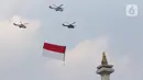 Tiga helikopter TNI AU mengibarkan bendera merah putih saat Upacara Peringatan Detik-Detik Proklamasi di kawasan Monas, Jakarta, Selasa (17/8/2021). Sebanyak enam helikopter TNI AU mengibarkan bendera merah putih berukuran 20 x 30 meter dalam rangka HUT ke-76 RI. (Liputan6.com/Herman Zakharia)