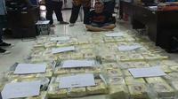 Nurhasan (46) pelaku pembawa narkoba seberat 115 kilogram dari Pekanbaru menuju Palembang. Dia diamankan oleh Badan Narkotika Nasional Provinsi (BNNP) Sumsel, Selasa (25/1/2023). (ISTIMEWA)