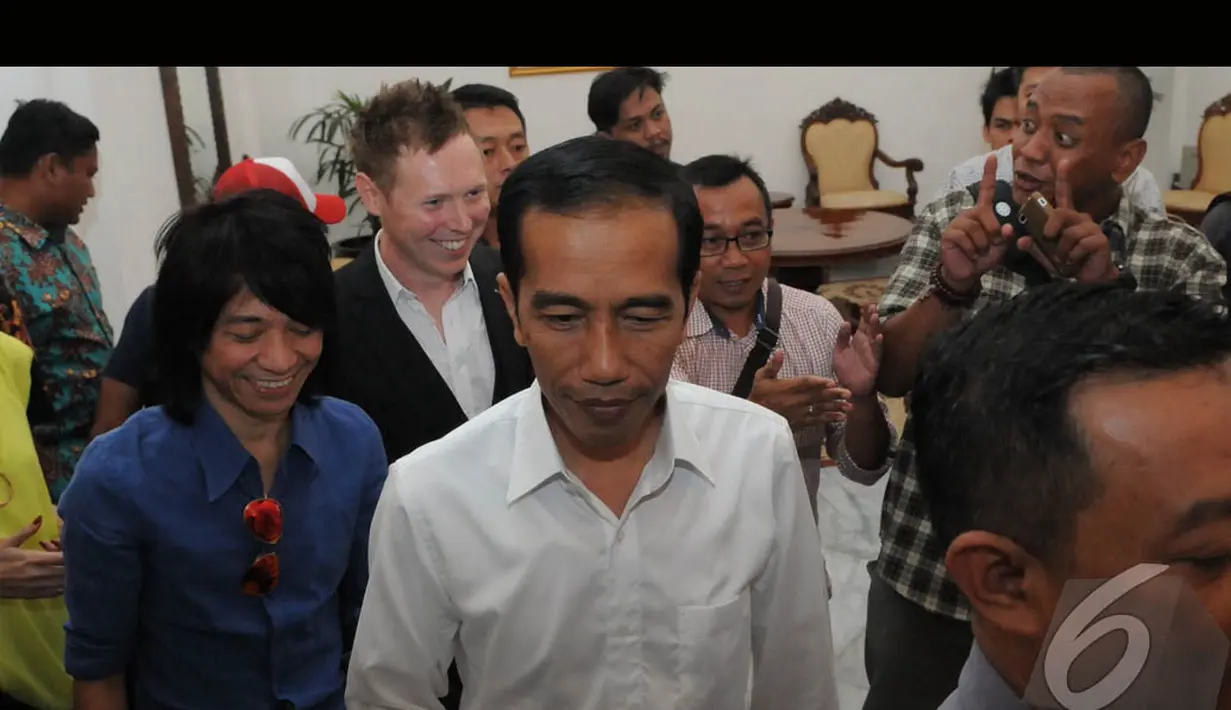 Personel Slank Abdee Negara (kiri) saat menemui Presiden terpilih Jokowi di Balaikota Jakarta (Liputan6.com/Herman Zakharia)