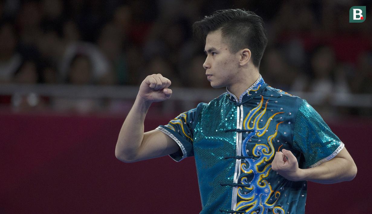 Atlet Wushu, Edgar Xavier, saat beraksi pada nomor Cangquan putra Asian Games di JIExpo, Jakarta, Minggu, (19/8/2018). Edgar Xavier berhasil meraih perak dengan angka 9.72. (Bola.com/Vitalis Yogi Trisna)