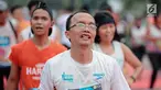 Ekspresi pelari saat mencapai garis finis dalam Jakarta Marathon 2018 di Gelora Bung Karno, Jakarta, Minggu (28/10). 12.500 pelari meramaikan Jakarta Marathon 2018, Memasuki tahun keenam, Jakarta Marathon yang di sponsori PLN. (Liputan6.com/Faizal Fanani)
